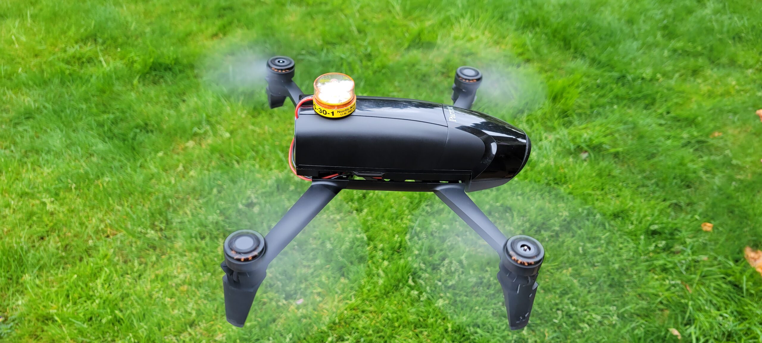 drone strobe attached to flying drone